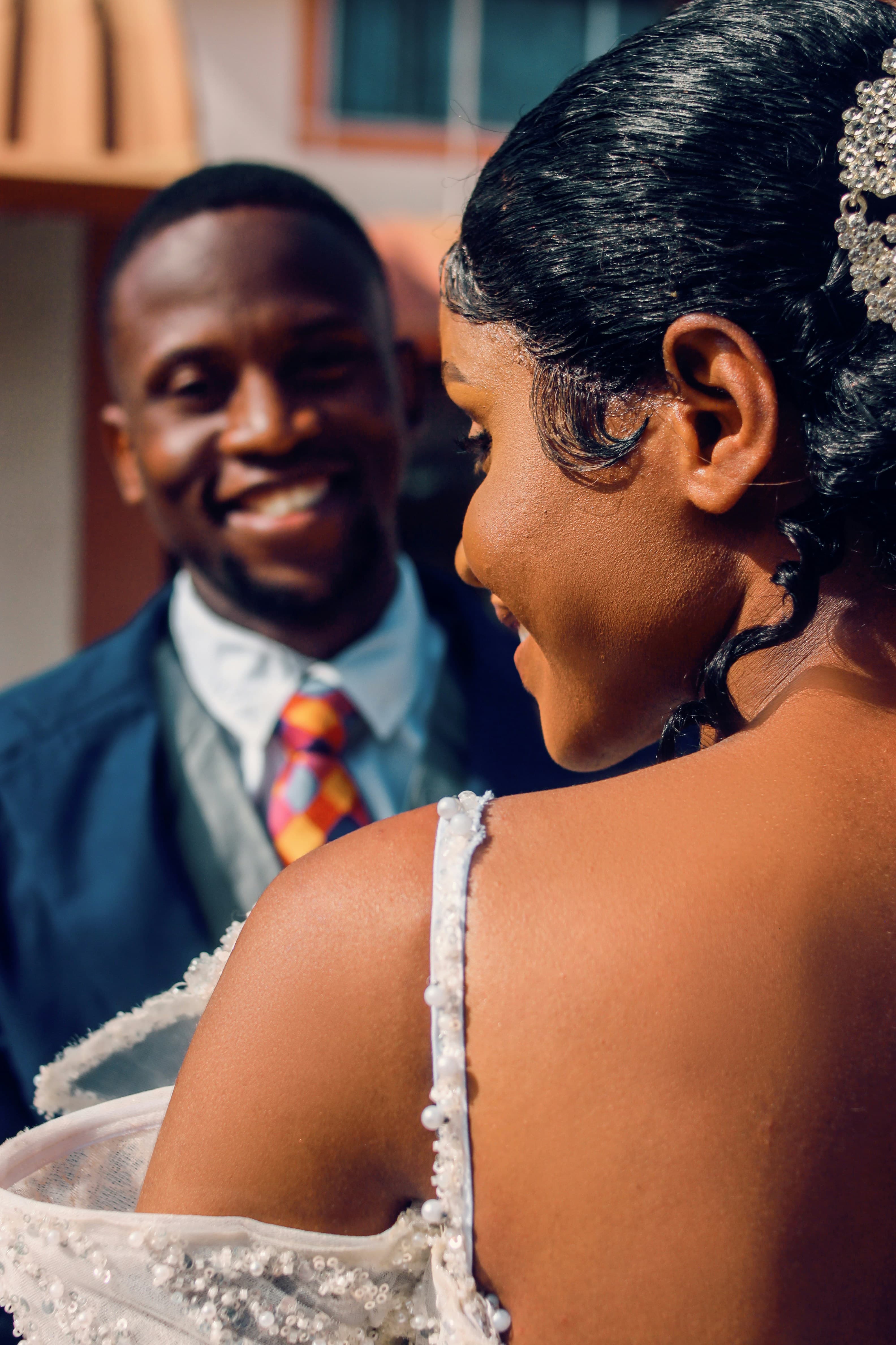 Close up of smilling couple in a wedding attire